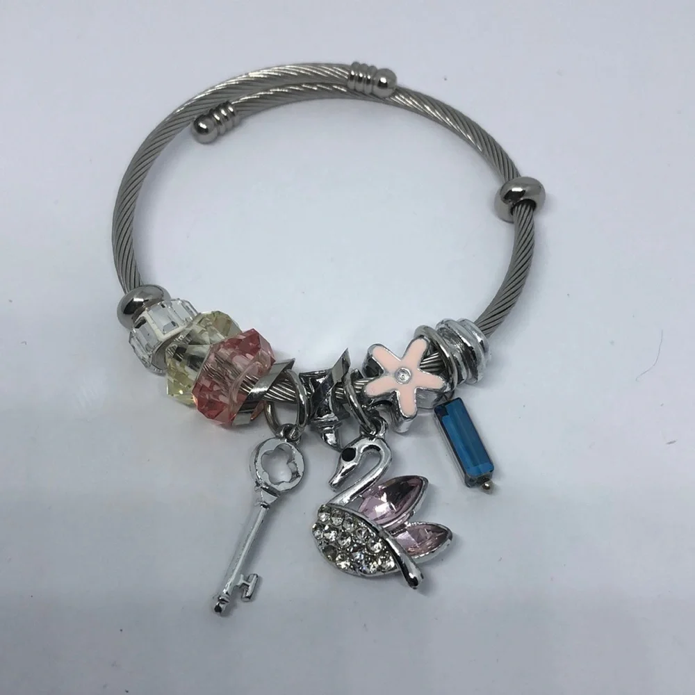 SILVER tone memory coil rope slide and dangle charm bracelet swan key flower.